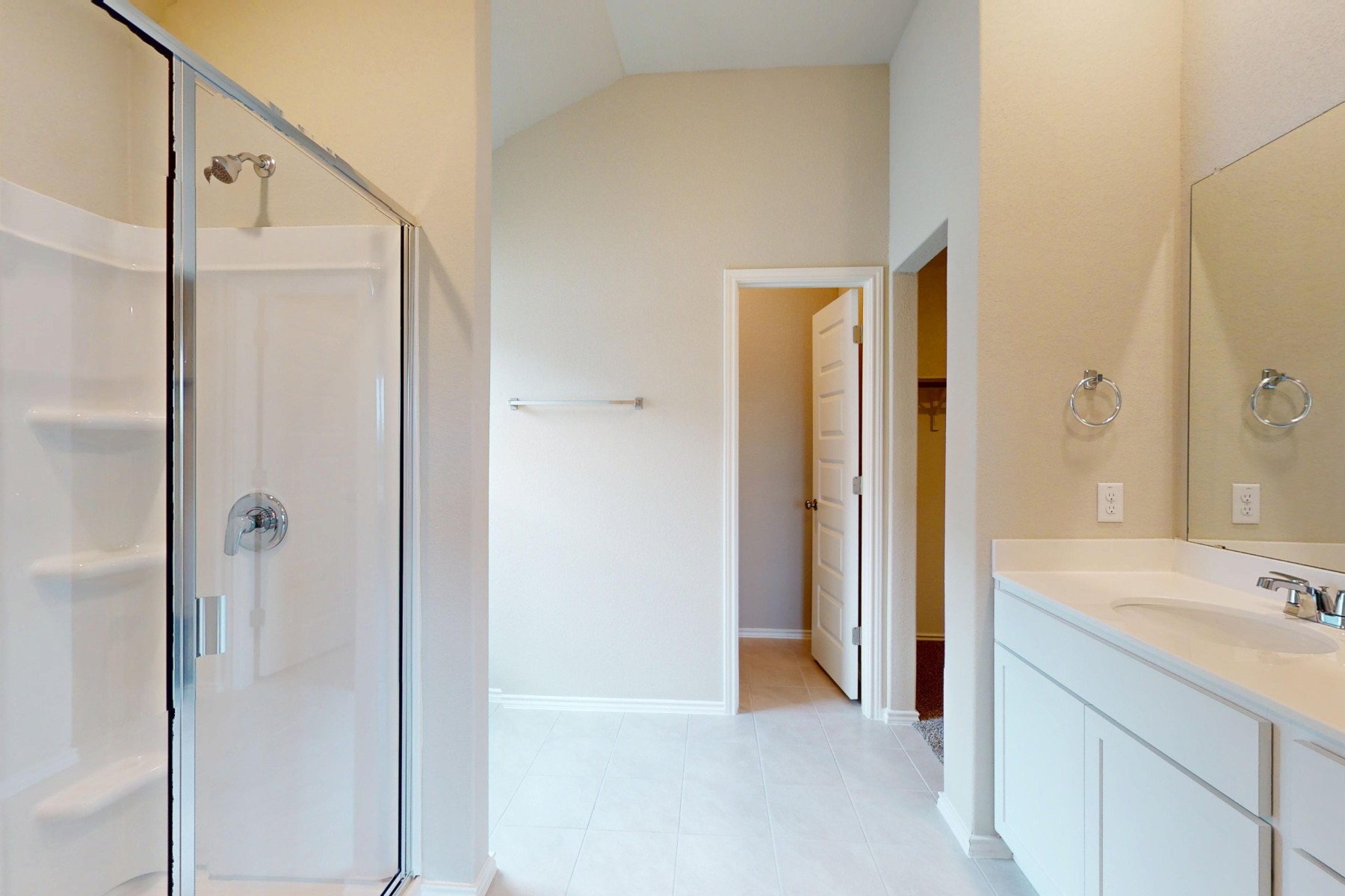 19917 Schatz Way Manor, TX 78653 - Photo 17 of 33 a bathroom with a double vanity sink and a mirror