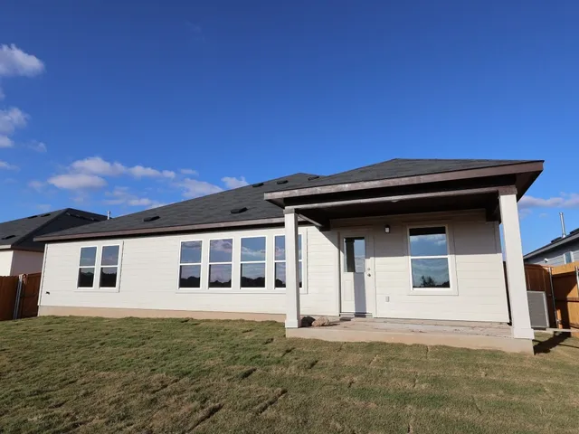 a house with trees in the background