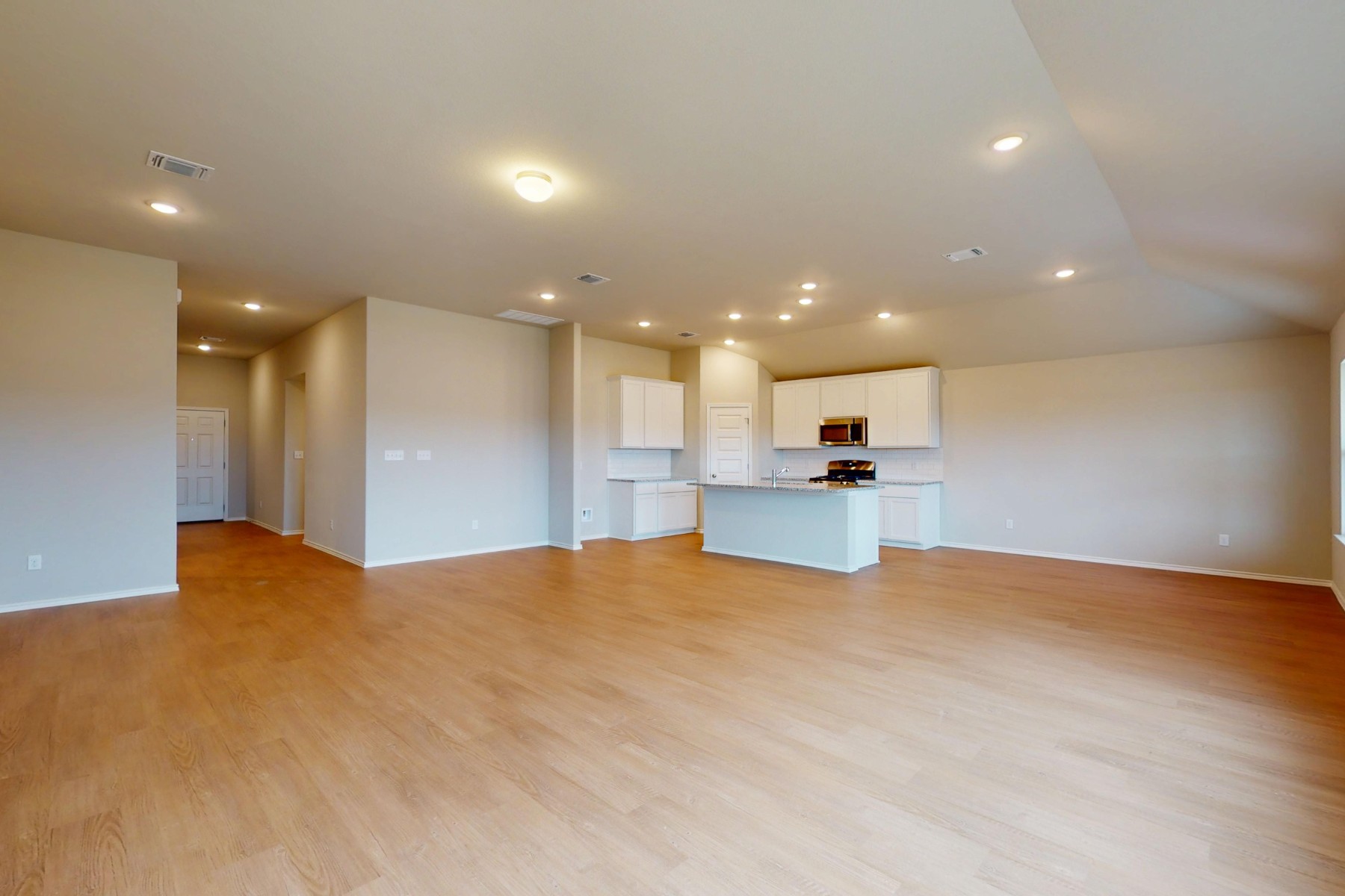 19917 Schatz Way Manor, TX 78653 - Photo 3 of 33 a view of kitchen and kitchen with a sink wooden floor