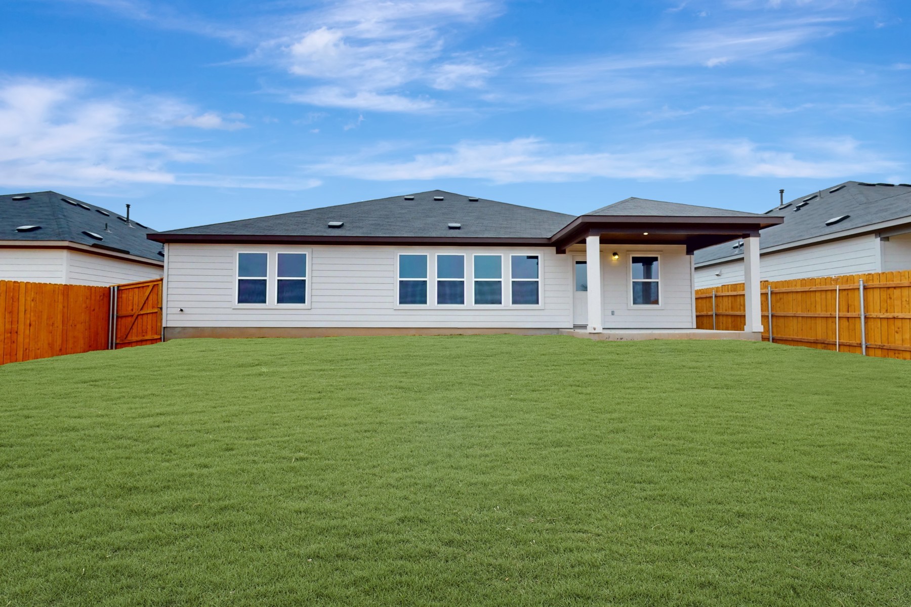 19917 Schatz Way Manor, TX 78653 - Photo 32 of 33 a front view of a house with a garden
