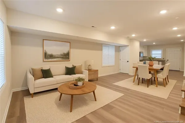 a living room with furniture and a table
