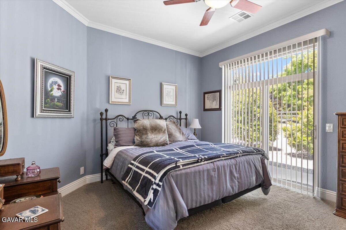 23840 Martingale Way Tehachapi, CA 93561 - Photo 34 of 63 a bedroom with a bed and a window
