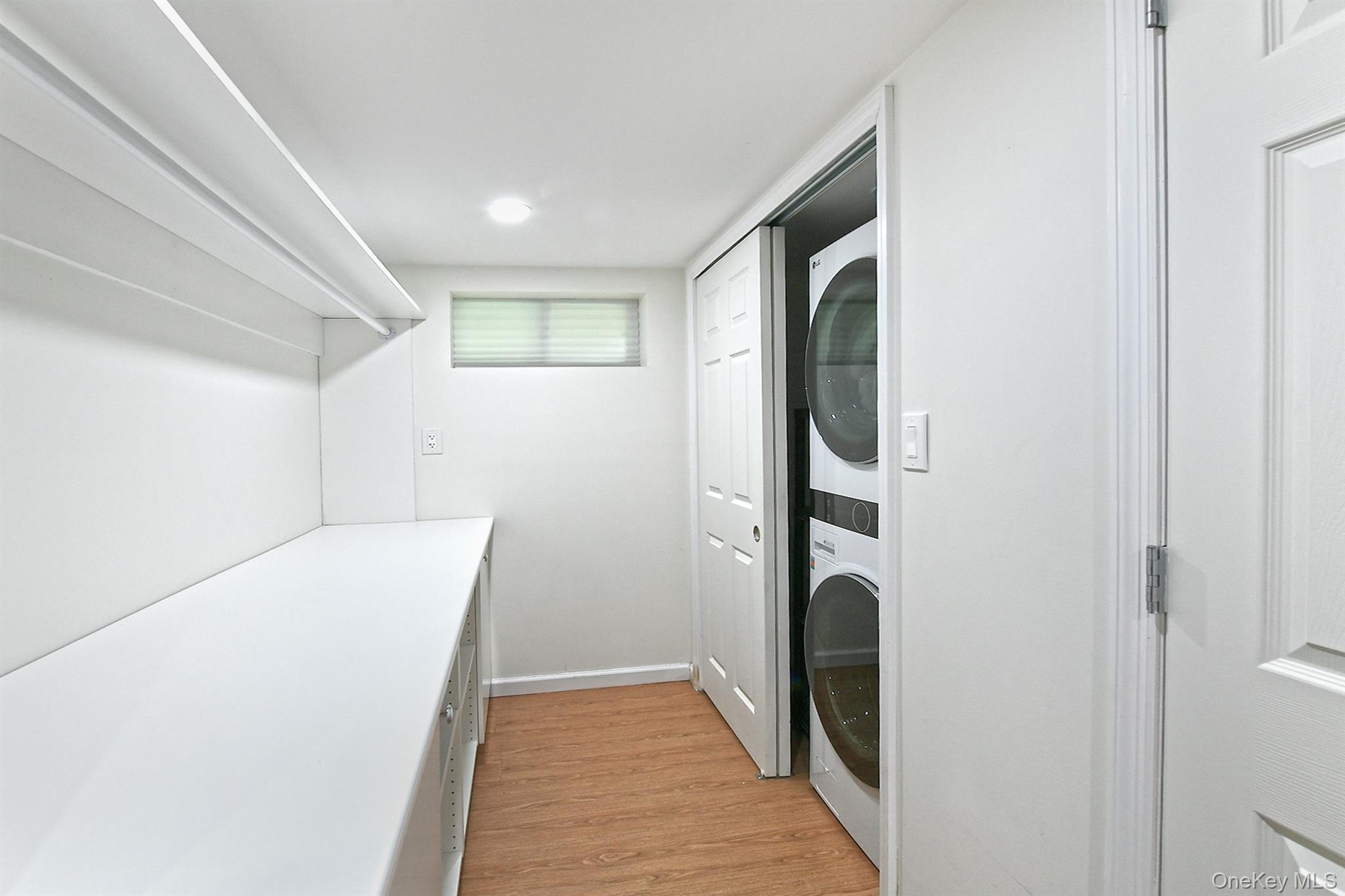 53 Stuart Drive Syosset, NY 11791 - Photo 19 of 24 a view of hallway with washer and dryer