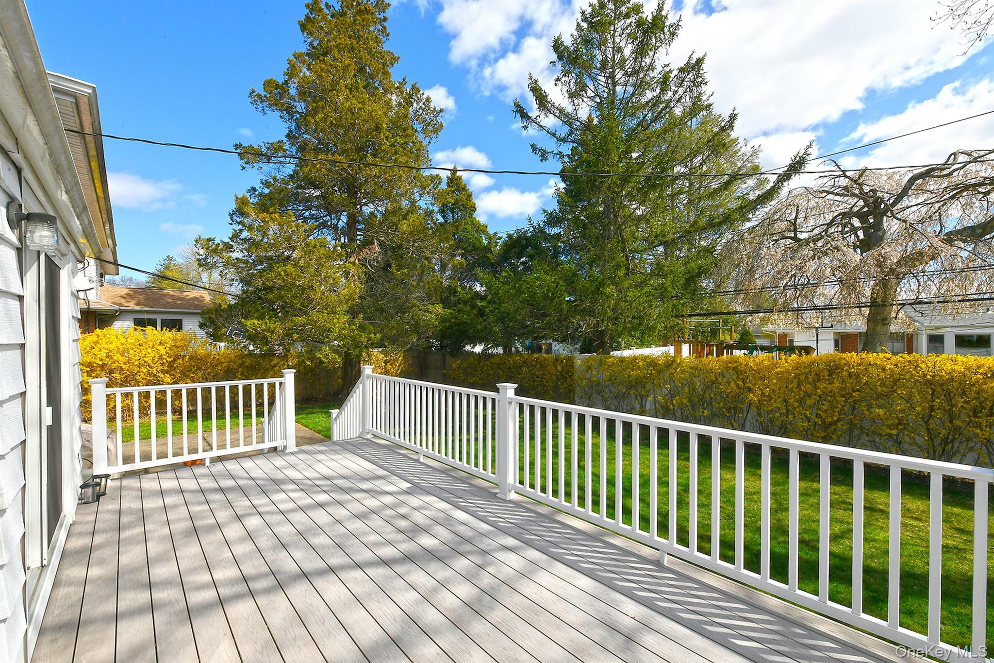 53 Stuart Drive Syosset, NY 11791 - Photo 21 of 24 a view of a wooden roof deck