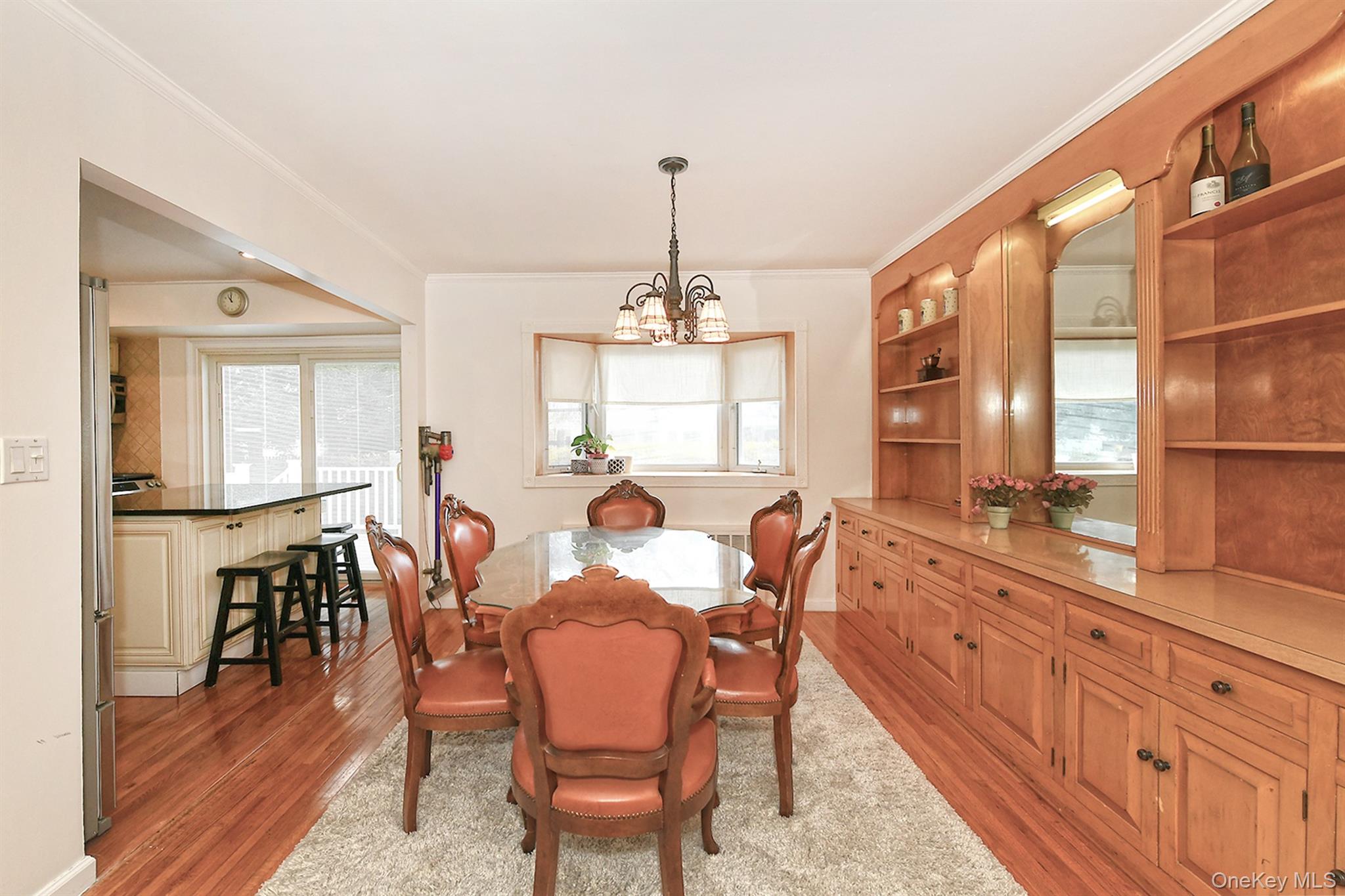 53 Stuart Drive Syosset, NY 11791 - Photo 5 of 24 a dining room with furniture window and wooden floor