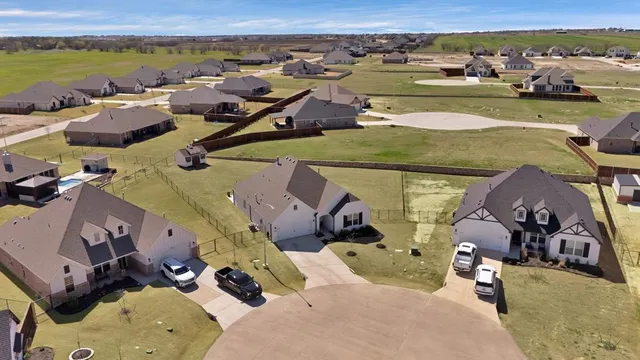 an aerial view of a house with outdoor space