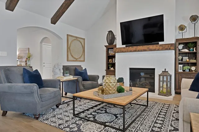 a living room with furniture and a flat screen tv