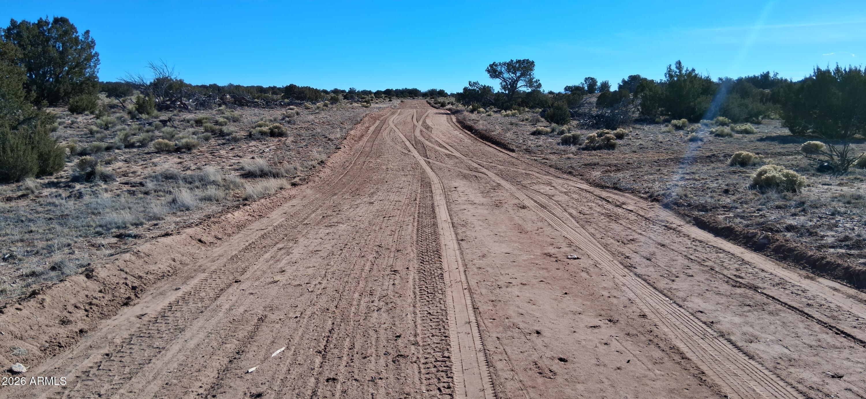 24 County Rd N6578, Unit 857 St. Johns, AZ 85936 - Photo 22 of 22 a view of a dry yard with wooden fence