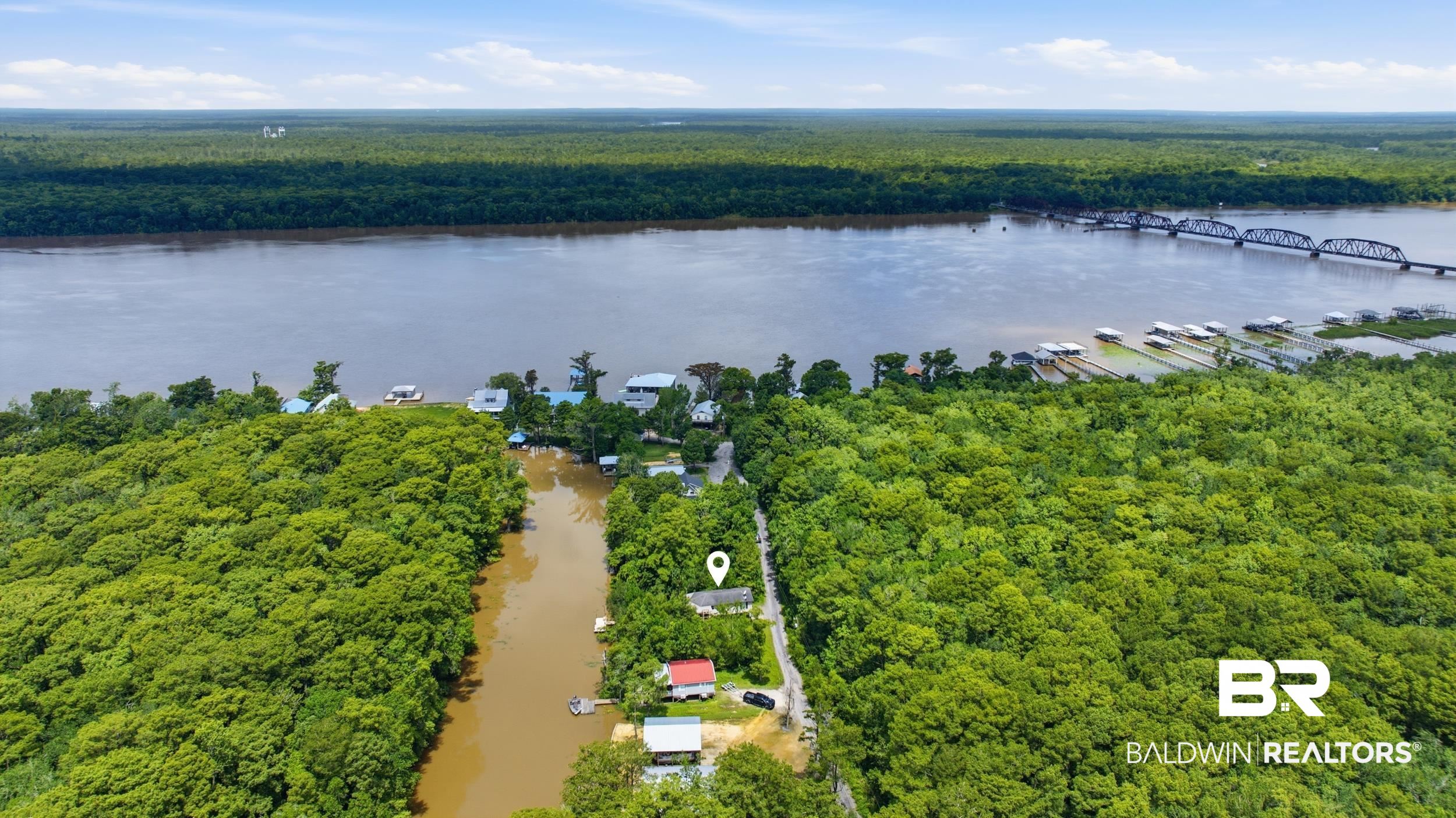42080 Bayou Road Bay Minette, AL 36507 - Photo 34 of 43 Aerial perspective featuring a riverfront property amidst extensive mature tree coverage