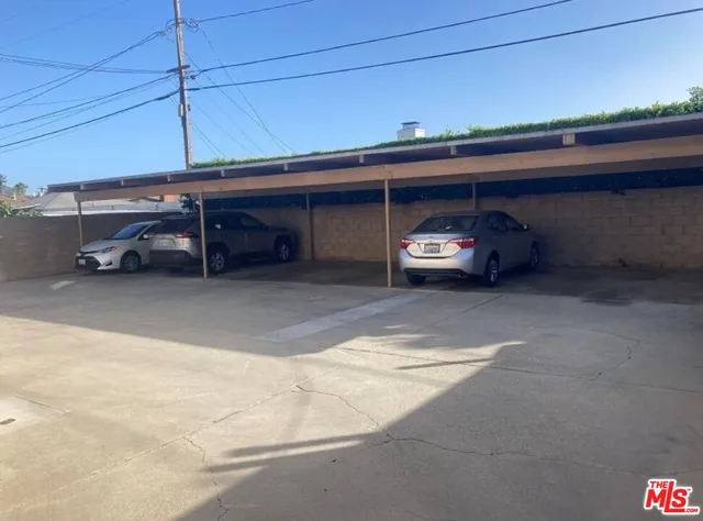 a view of garage with cars