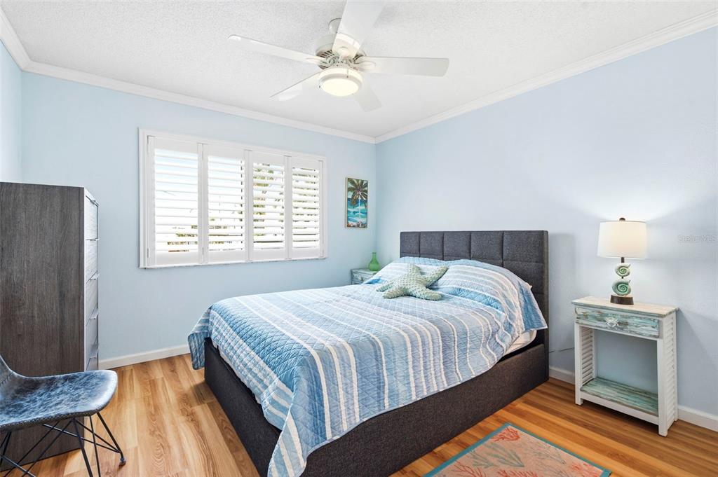 14800 Walsingham Road, Unit 702 Largo, FL 33774 - Photo 29 of 42 a bedroom with a bed and a table