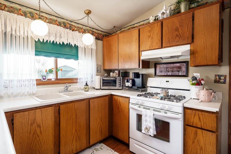 17427 West Douglas Road Brodhead, WI 53520 - Photo 72 of 89 a kitchen with stainless steel appliances a stove a sink and a microwave