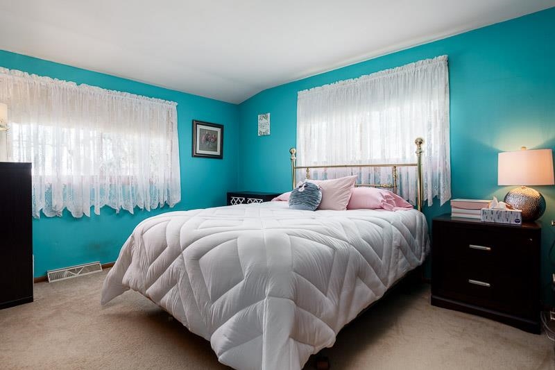 17427 West Douglas Road Brodhead, WI 53520 - Photo 83 of 89 a bedroom with a bed and a night stand