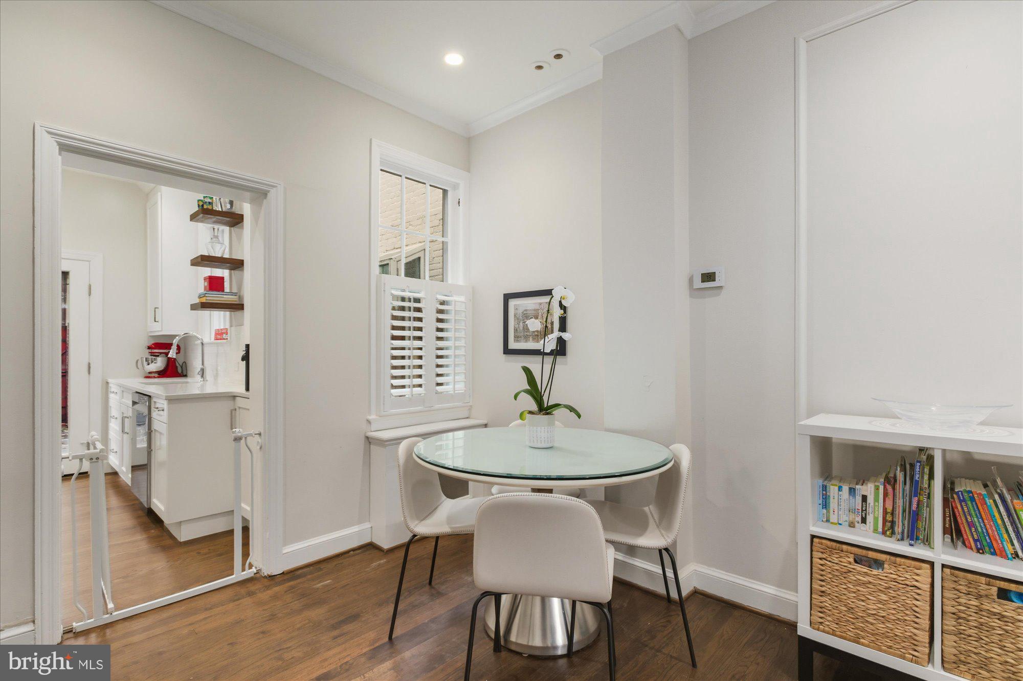 1341 28th Street Northwest Washington, DC 20007 - Photo 5 of 17 a dining room with furniture and wooden floor