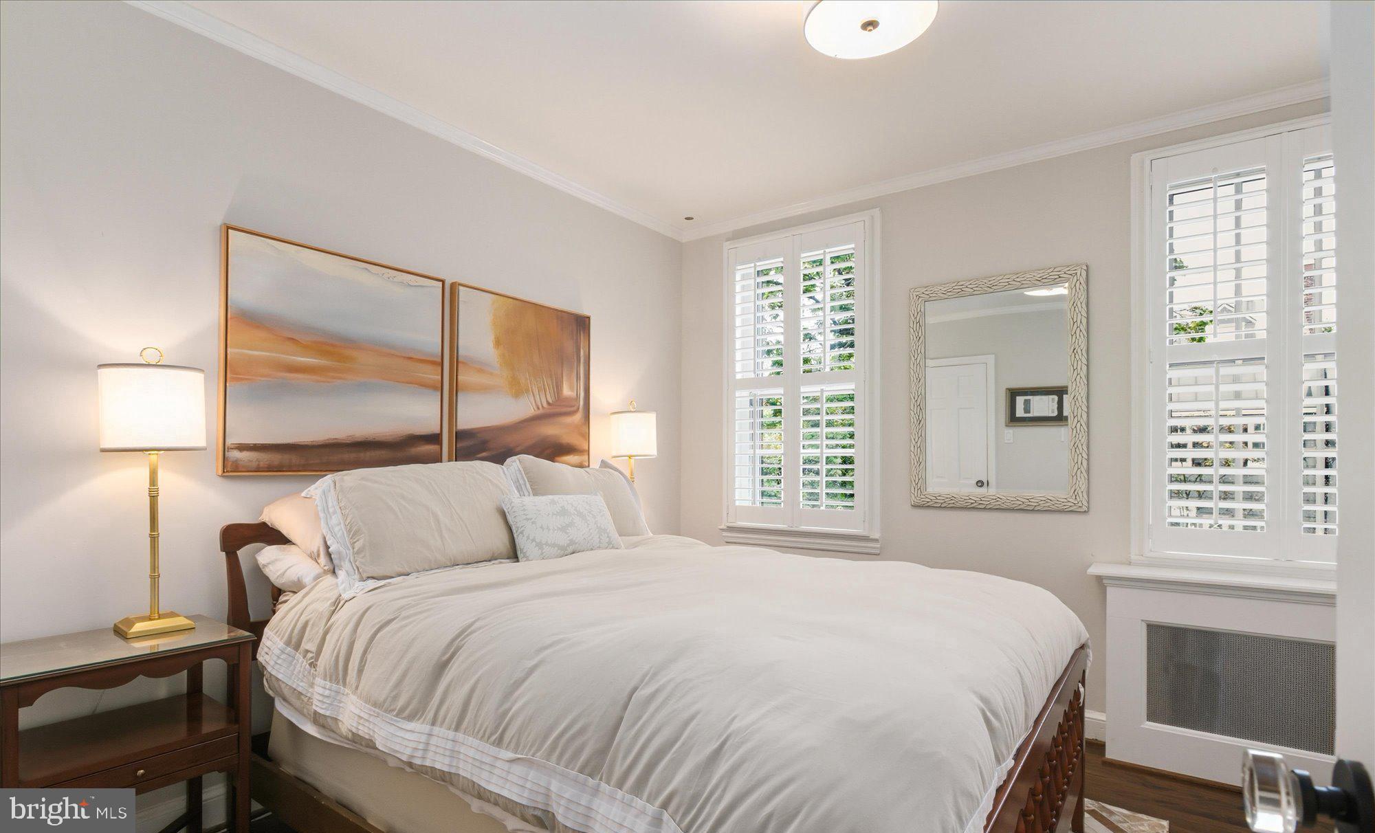 1341 28th Street Northwest Washington, DC 20007 - Photo 8 of 17 a bedroom with a large bed and a window
