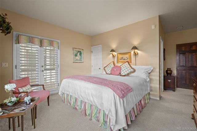 a bedroom with a bed and a night stand