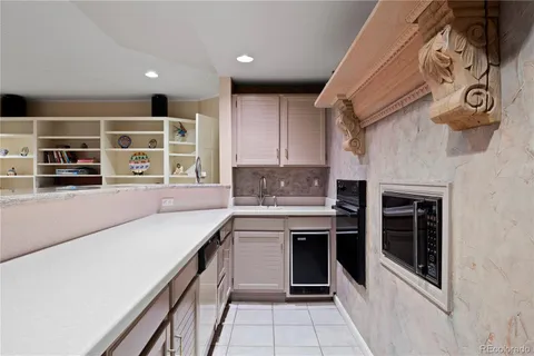a view of a patio with table and chairs