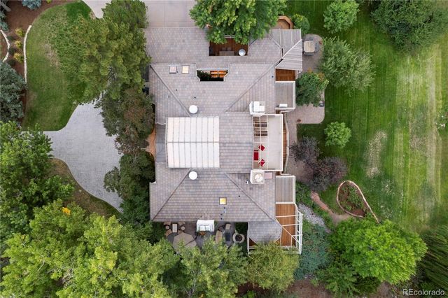 a view of a patio with table and chairs and potted plants