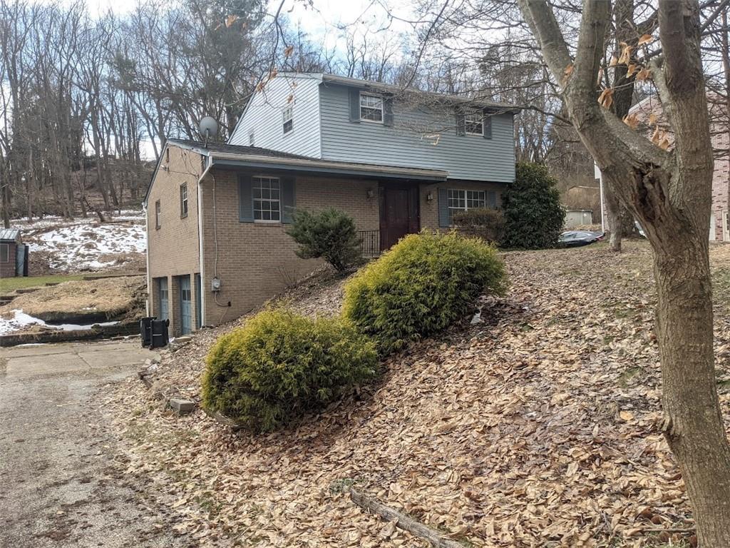 9870 Bellcrest Road Pittsburgh, PA 15237 - Photo 1 of 17 a view of a house with a yard and garage