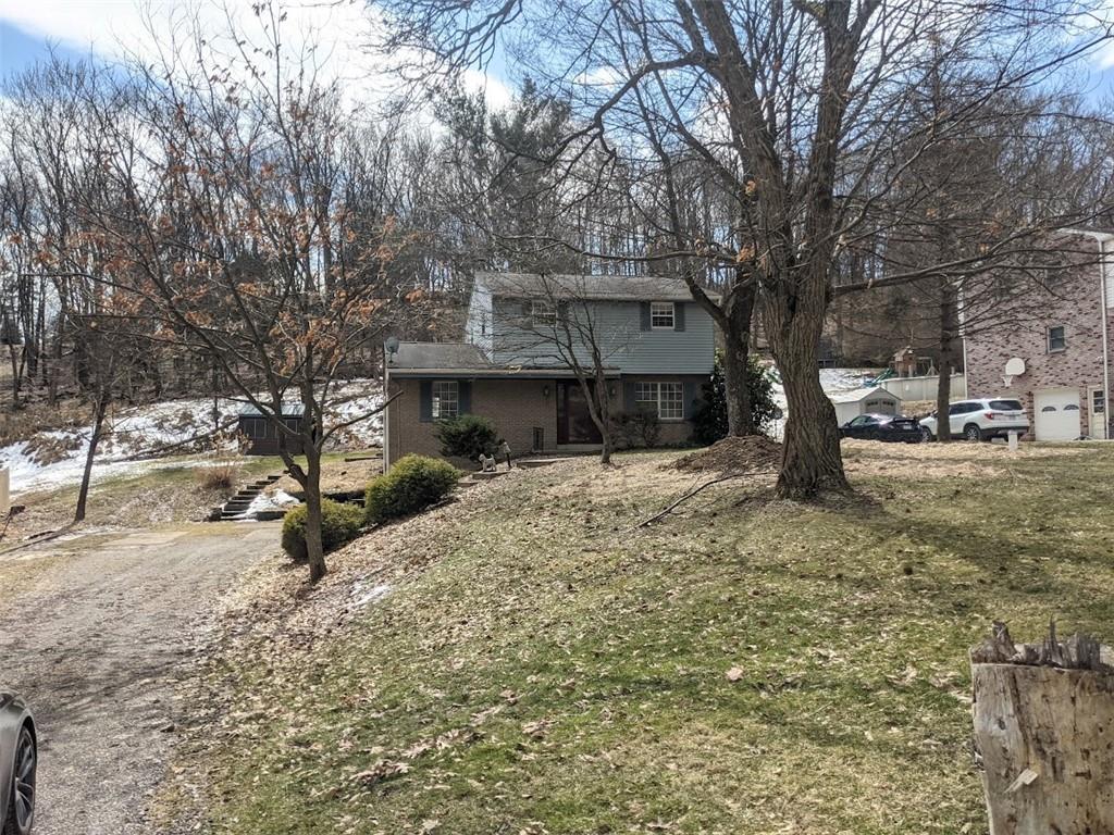 9870 Bellcrest Road Pittsburgh, PA 15237 - Photo 2 of 17 a view of a house with a yard covered in snow