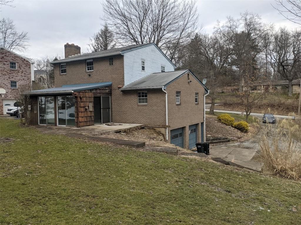 9870 Bellcrest Road Pittsburgh, PA 15237 - Photo 3 of 17 a view of a house with a yard and large tree