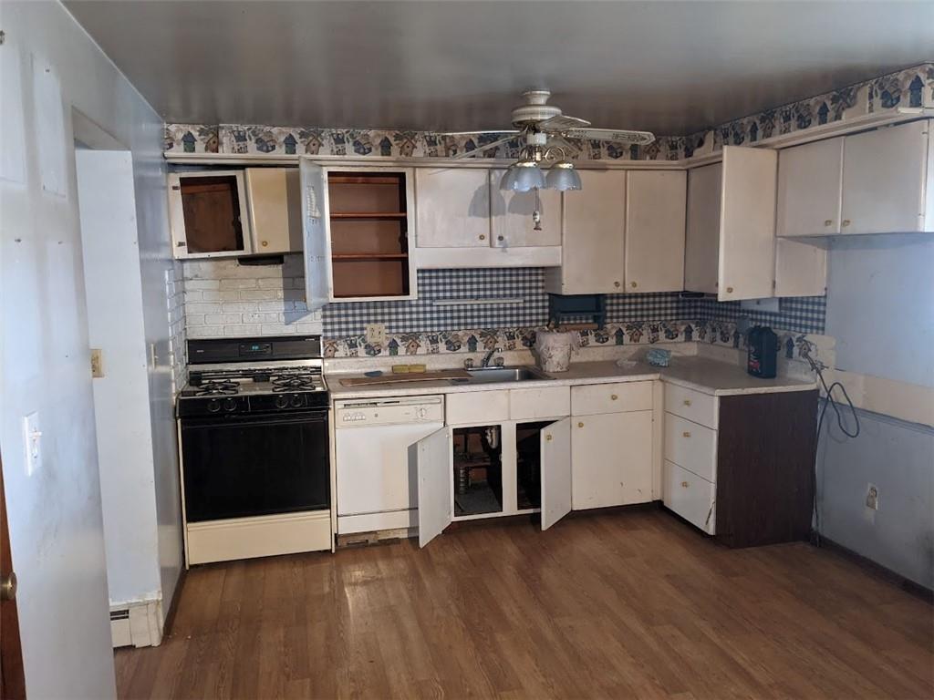 9870 Bellcrest Road Pittsburgh, PA 15237 - Photo 6 of 17 a kitchen with a stove top oven and cabinets
