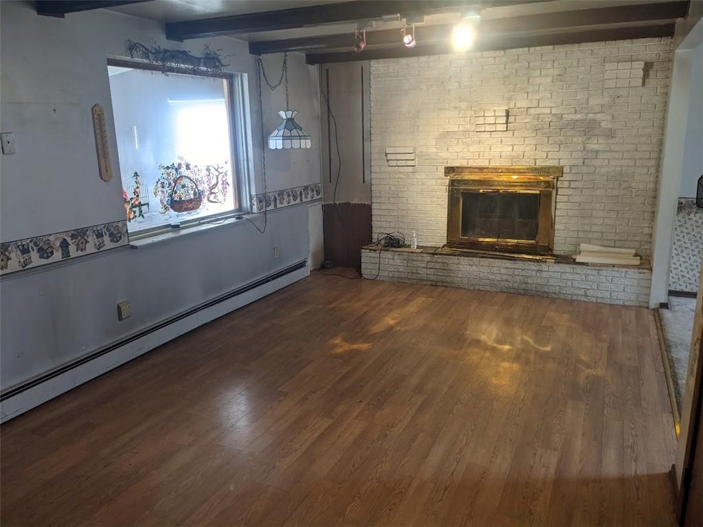 9870 Bellcrest Road Pittsburgh, PA 15237 - Photo 7 of 17 a view of an empty room with wooden floor and a window