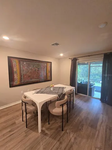 a large kitchen with stainless steel appliances lots of counter top space