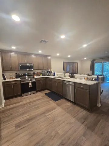 a bedroom with bed and window