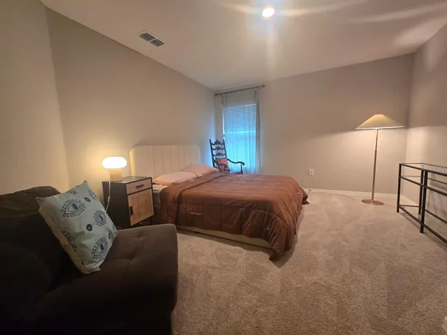 a bathroom with a double vanity sink toilet and a mirror