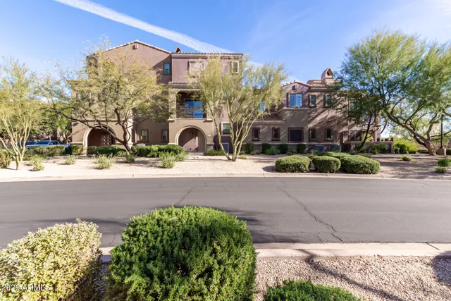 a view of building with lot of trees