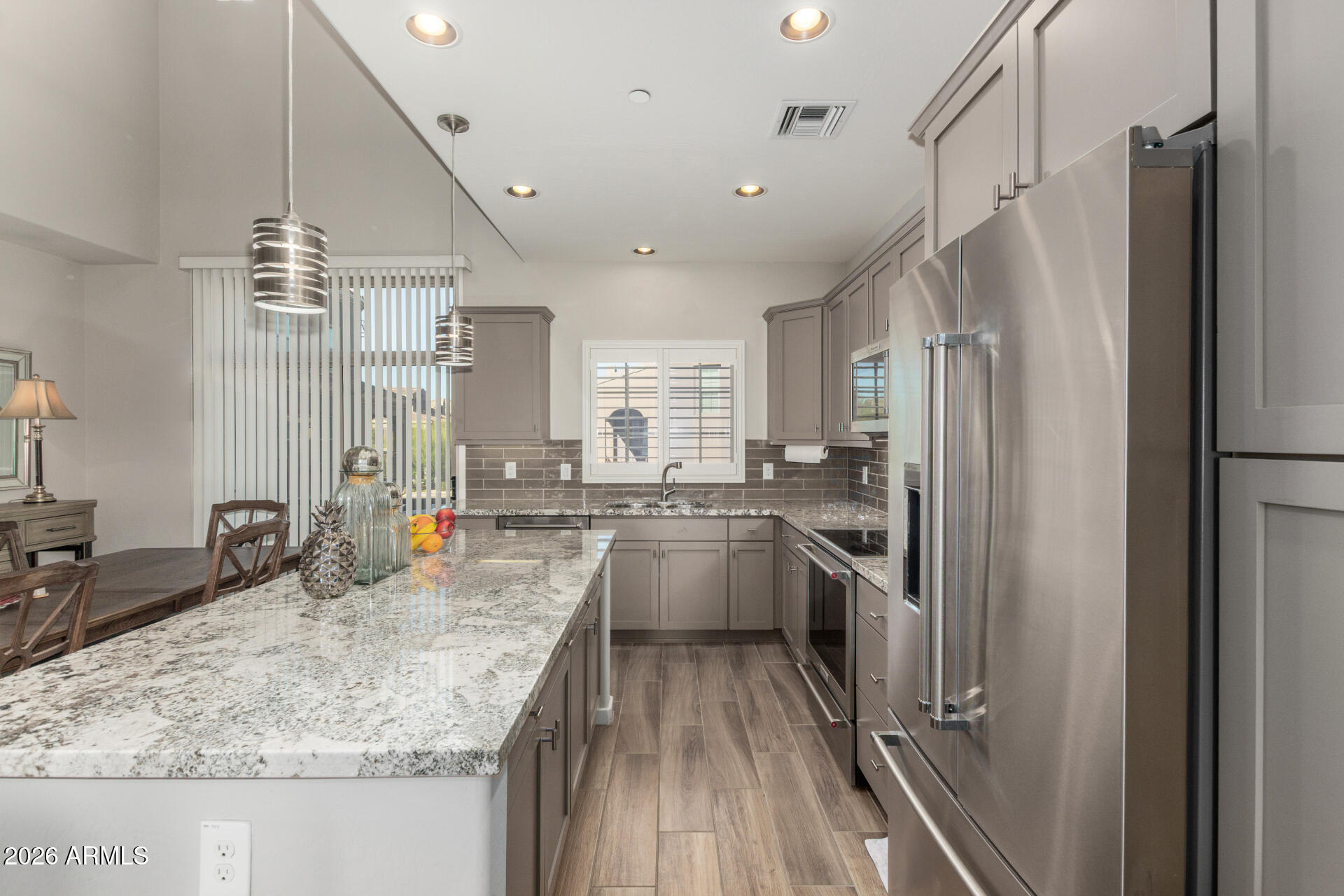 3935 East Rough Rider Road, Unit 1285 Phoenix, AZ 85050 - Photo 11 of 40 a kitchen with refrigerator and stove