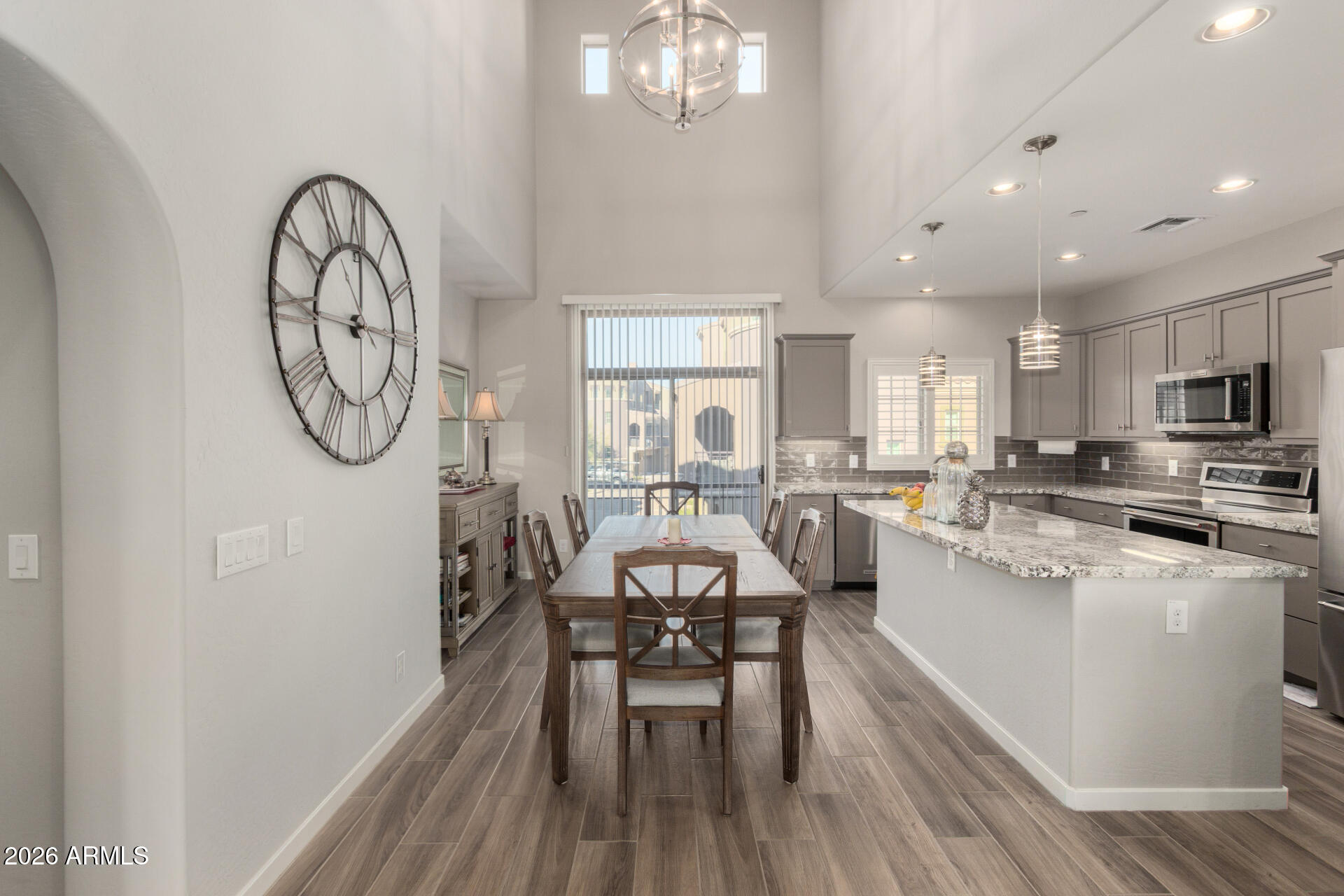 3935 East Rough Rider Road, Unit 1285 Phoenix, AZ 85050 - Photo 13 of 40 a view of a dining room with furniture window and wooden floor