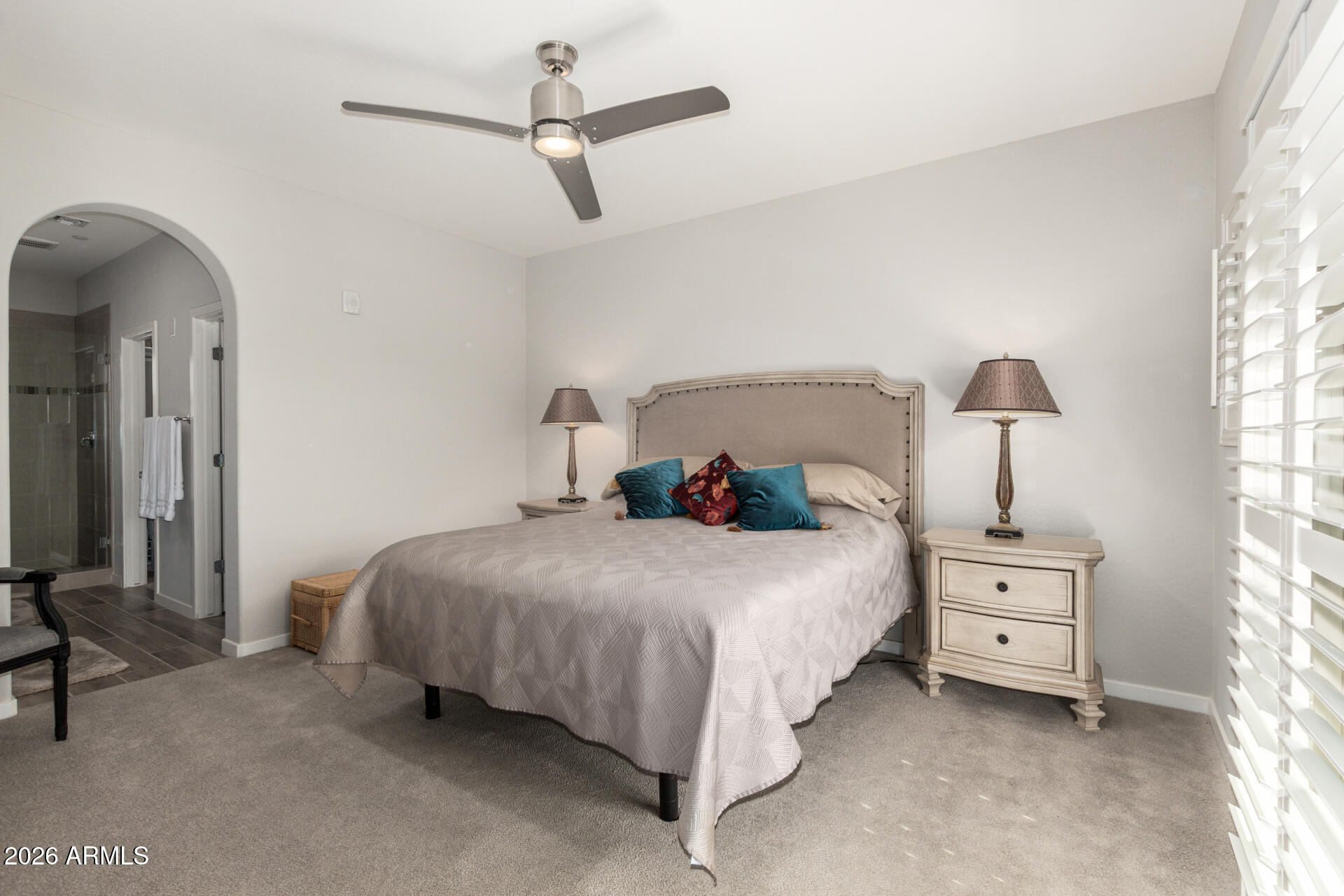 3935 East Rough Rider Road, Unit 1285 Phoenix, AZ 85050 - Photo 16 of 40 a bedroom with a bed and a window