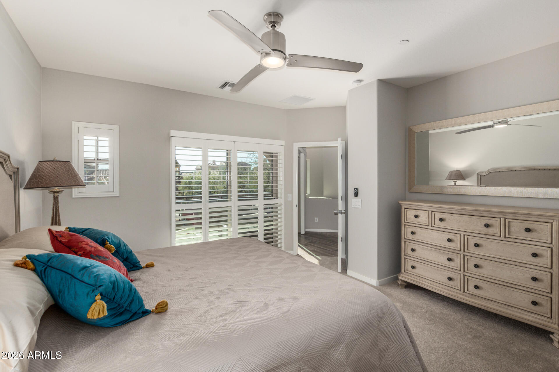 3935 East Rough Rider Road, Unit 1285 Phoenix, AZ 85050 - Photo 17 of 40 a bedroom with a bed and a window