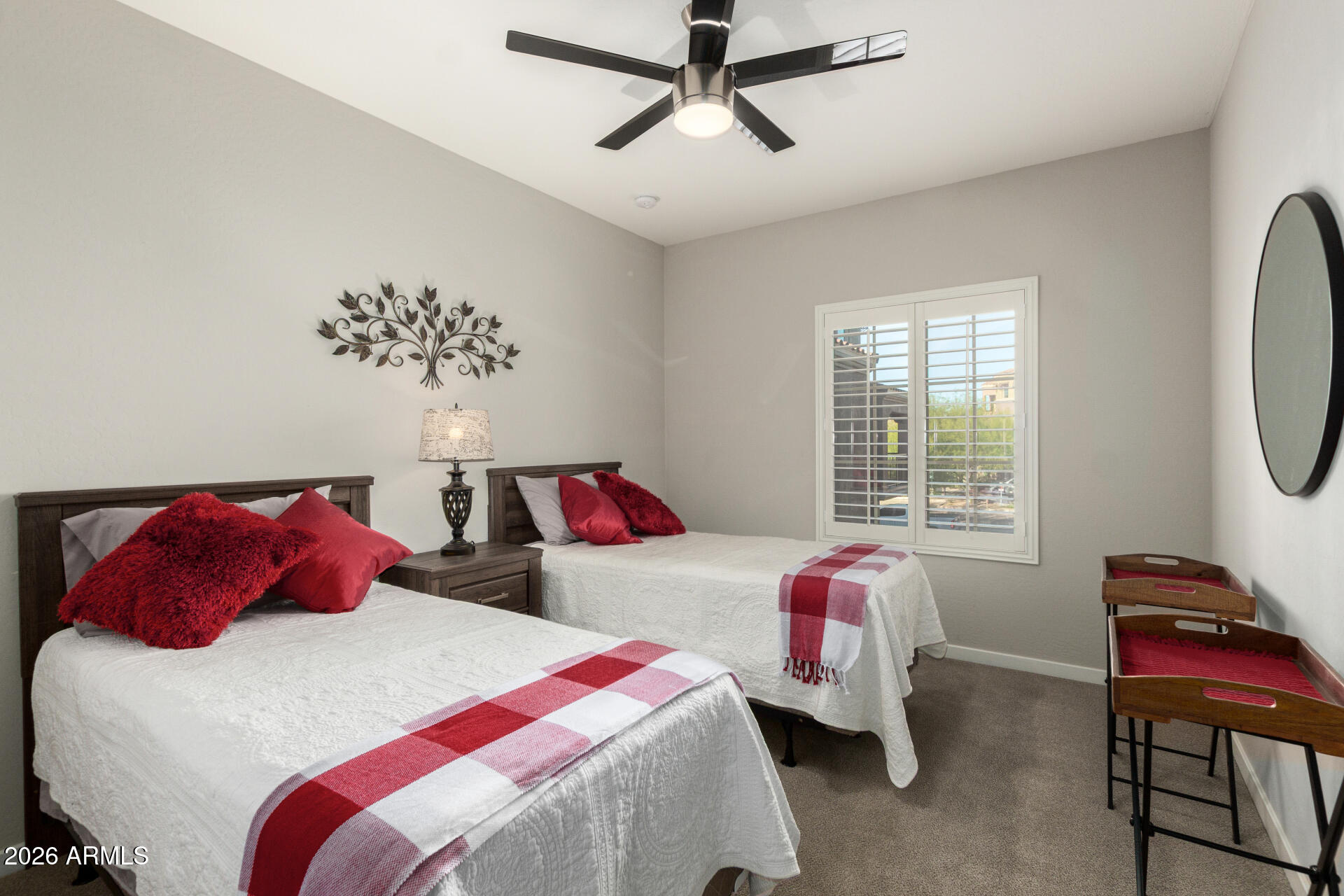 3935 East Rough Rider Road, Unit 1285 Phoenix, AZ 85050 - Photo 20 of 40 a bedroom with a bed and a chandelier