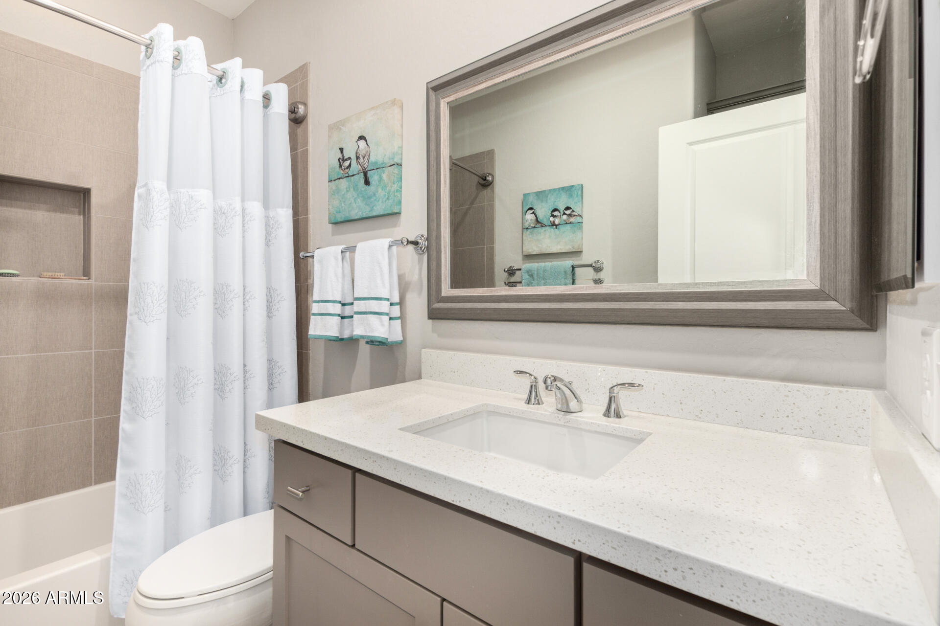 3935 East Rough Rider Road, Unit 1285 Phoenix, AZ 85050 - Photo 26 of 40 a bathroom with a sink toilet and shower