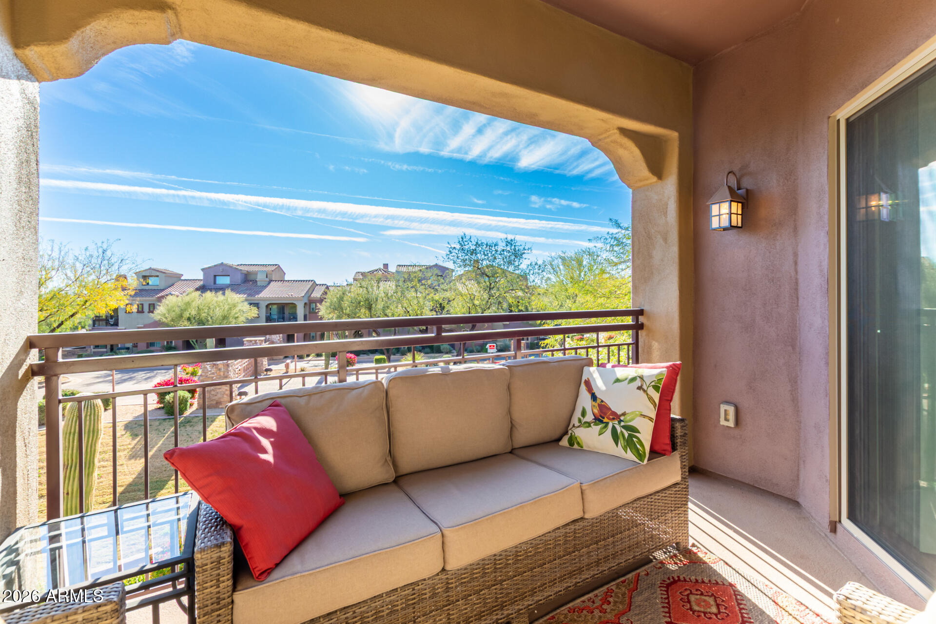 3935 East Rough Rider Road, Unit 1285 Phoenix, AZ 85050 - Photo 30 of 40 a living room with a couch and a table
