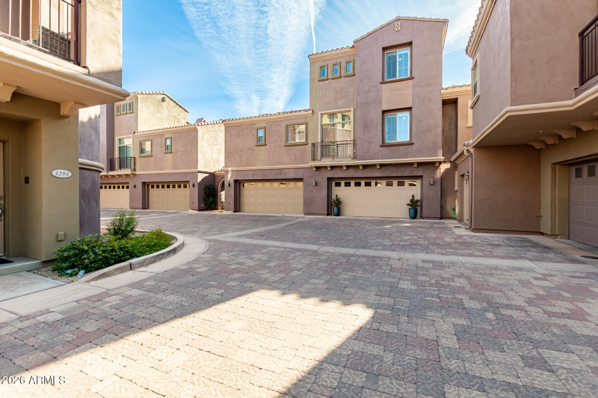 3935 East Rough Rider Road, Unit 1285 Phoenix, AZ 85050 - Photo 31 of 40 a view of a building with a yard