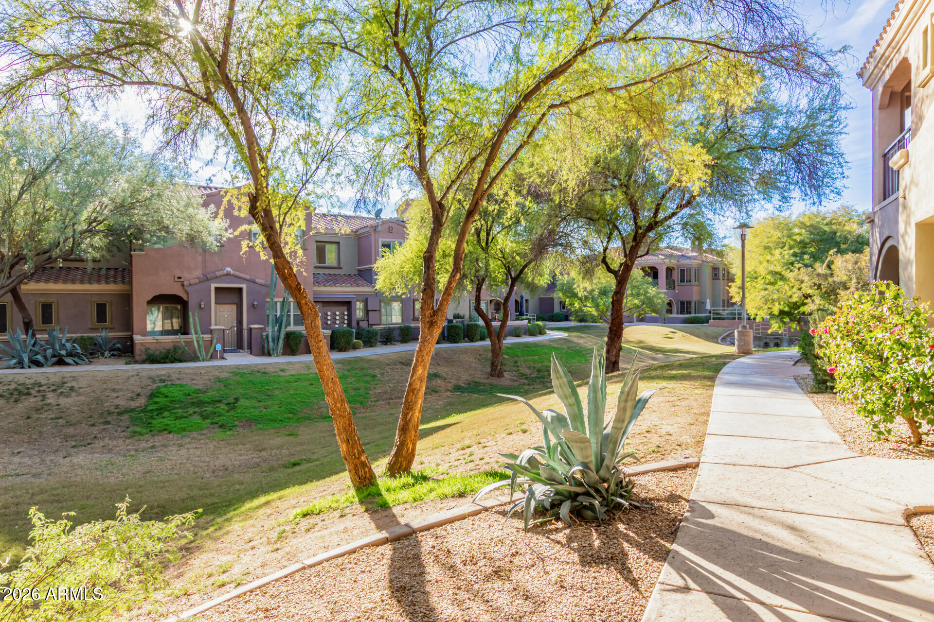 3935 East Rough Rider Road, Unit 1285 Phoenix, AZ 85050 - Photo 32 of 40 a view of a house with backyard and sitting area