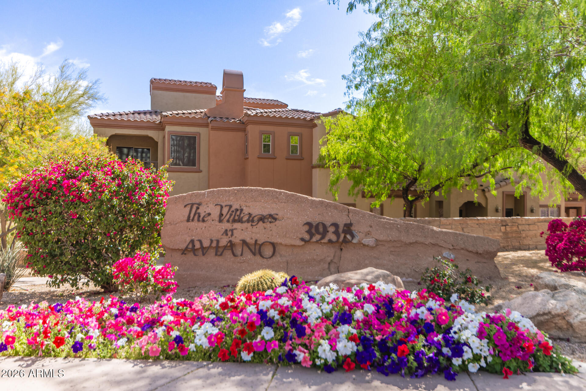3935 East Rough Rider Road, Unit 1285 Phoenix, AZ 85050 - Photo 35 of 40 a front view of house with yard