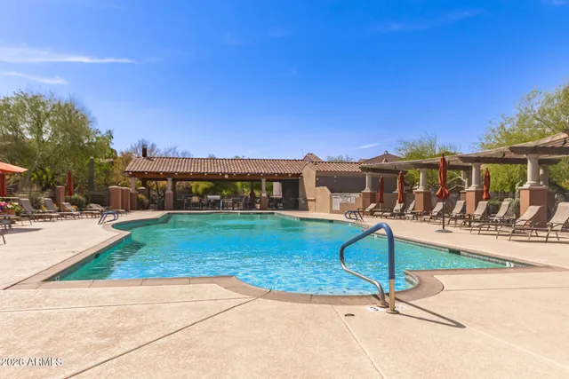 a view of a house with backyard porch and sitting area