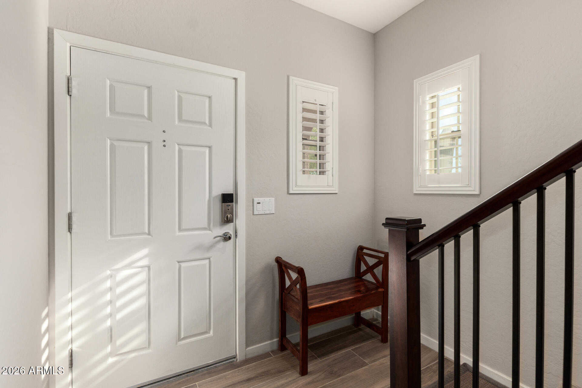 3935 East Rough Rider Road, Unit 1285 Phoenix, AZ 85050 - Photo 5 of 40 a view of entryway with wooden floor and stairs