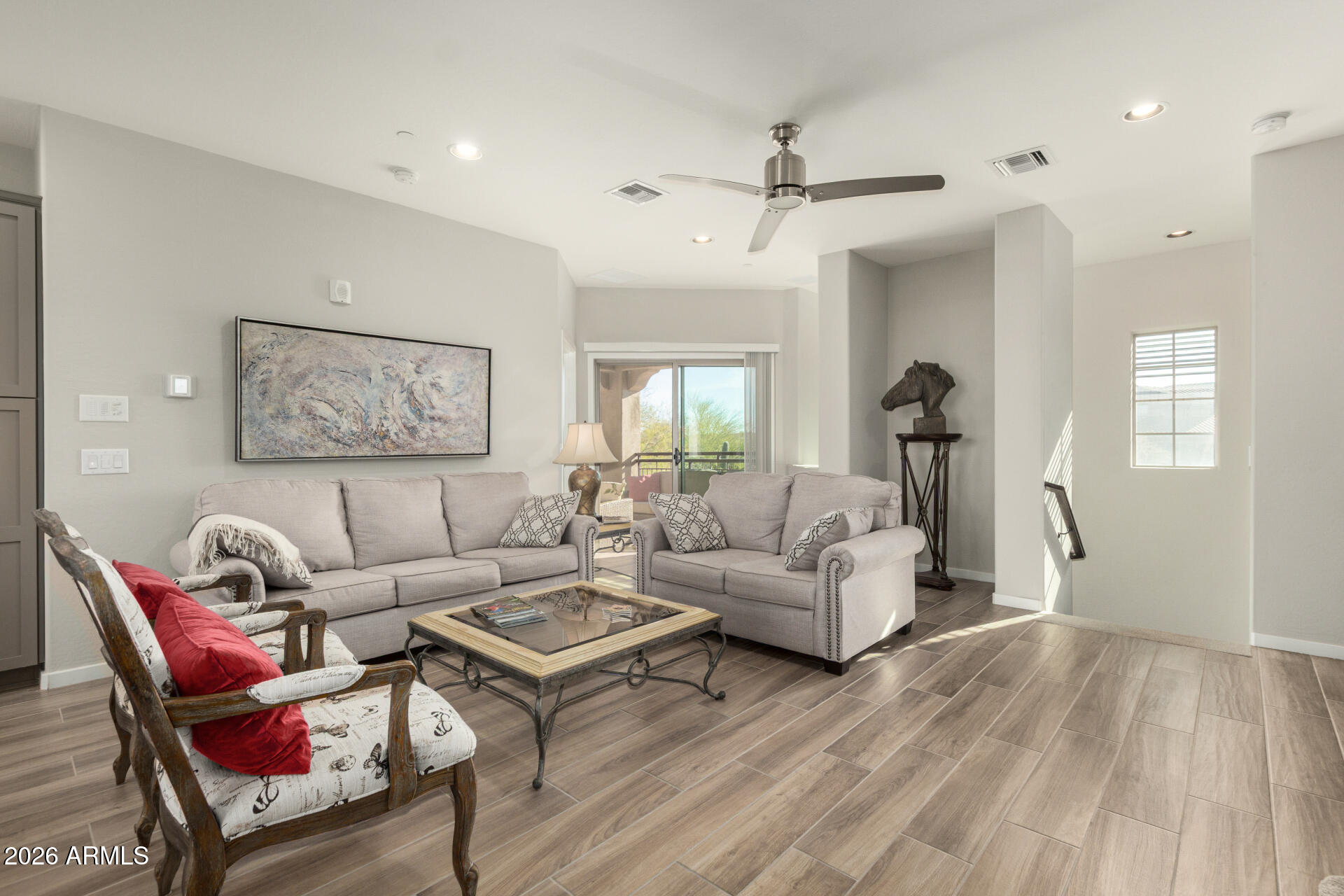 3935 East Rough Rider Road, Unit 1285 Phoenix, AZ 85050 - Photo 6 of 40 a living room with furniture and a wooden floor