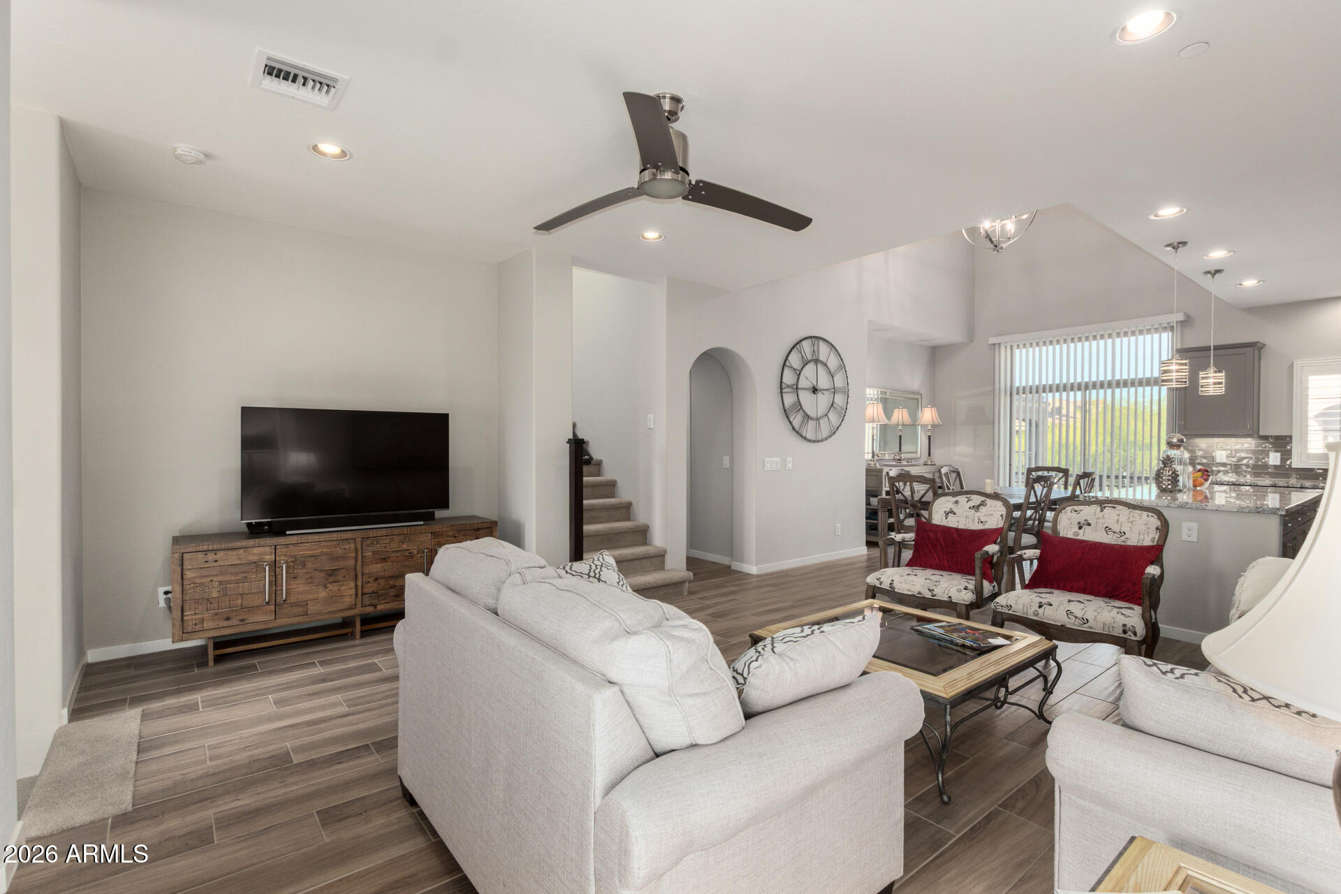 3935 East Rough Rider Road, Unit 1285 Phoenix, AZ 85050 - Photo 9 of 40 a living room with furniture and a flat screen tv