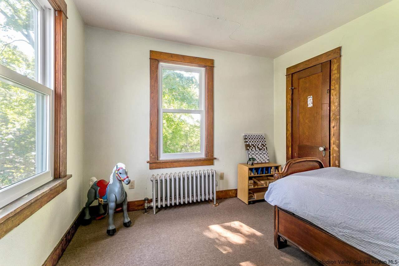 807 Leeds Athens Road Athens, NY 12015 - Photo 21 of 29 a bedroom with a bed and a window