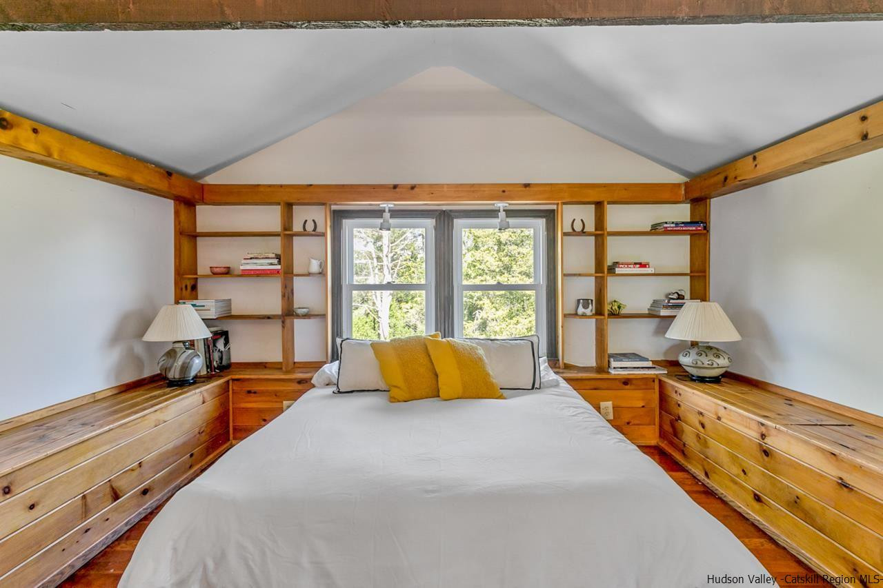807 Leeds Athens Road Athens, NY 12015 - Photo 25 of 29 a large bed sitting in a bedroom next to a window
