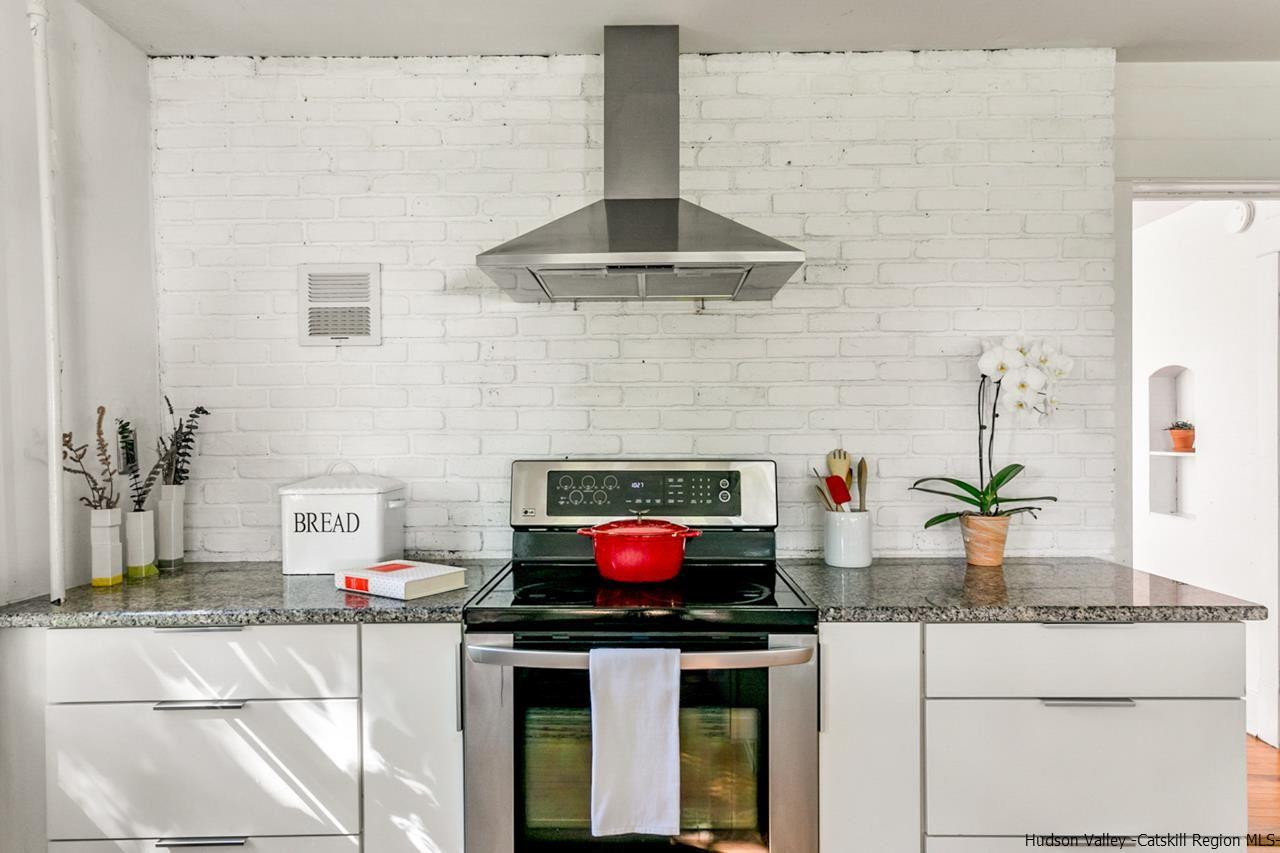 807 Leeds Athens Road Athens, NY 12015 - Photo 5 of 29 a kitchen with stainless steel appliances granite countertop a stove and a sink