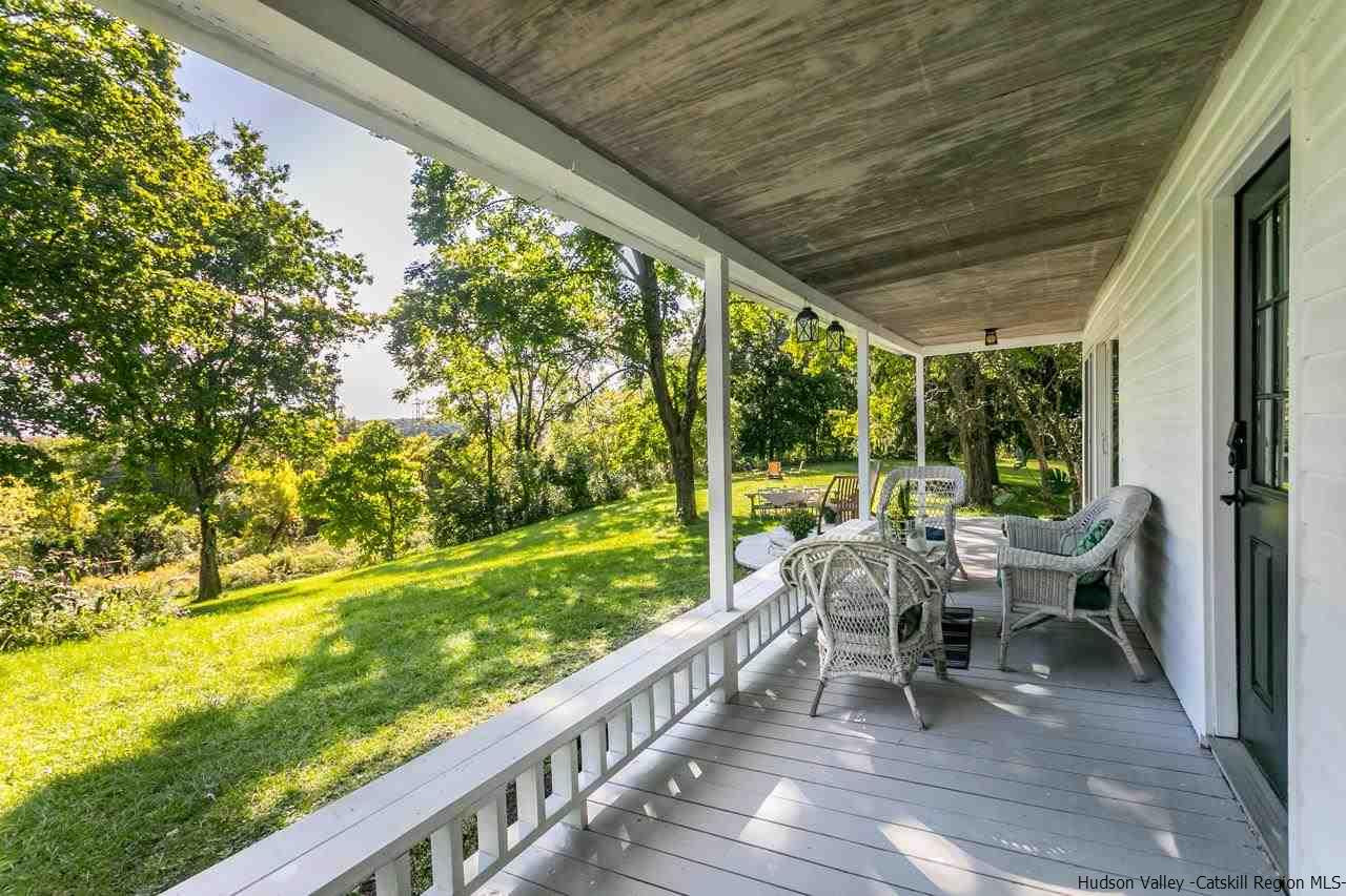 807 Leeds Athens Road Athens, NY 12015 - Photo 8 of 29 a view of a porch with chairs and backyard