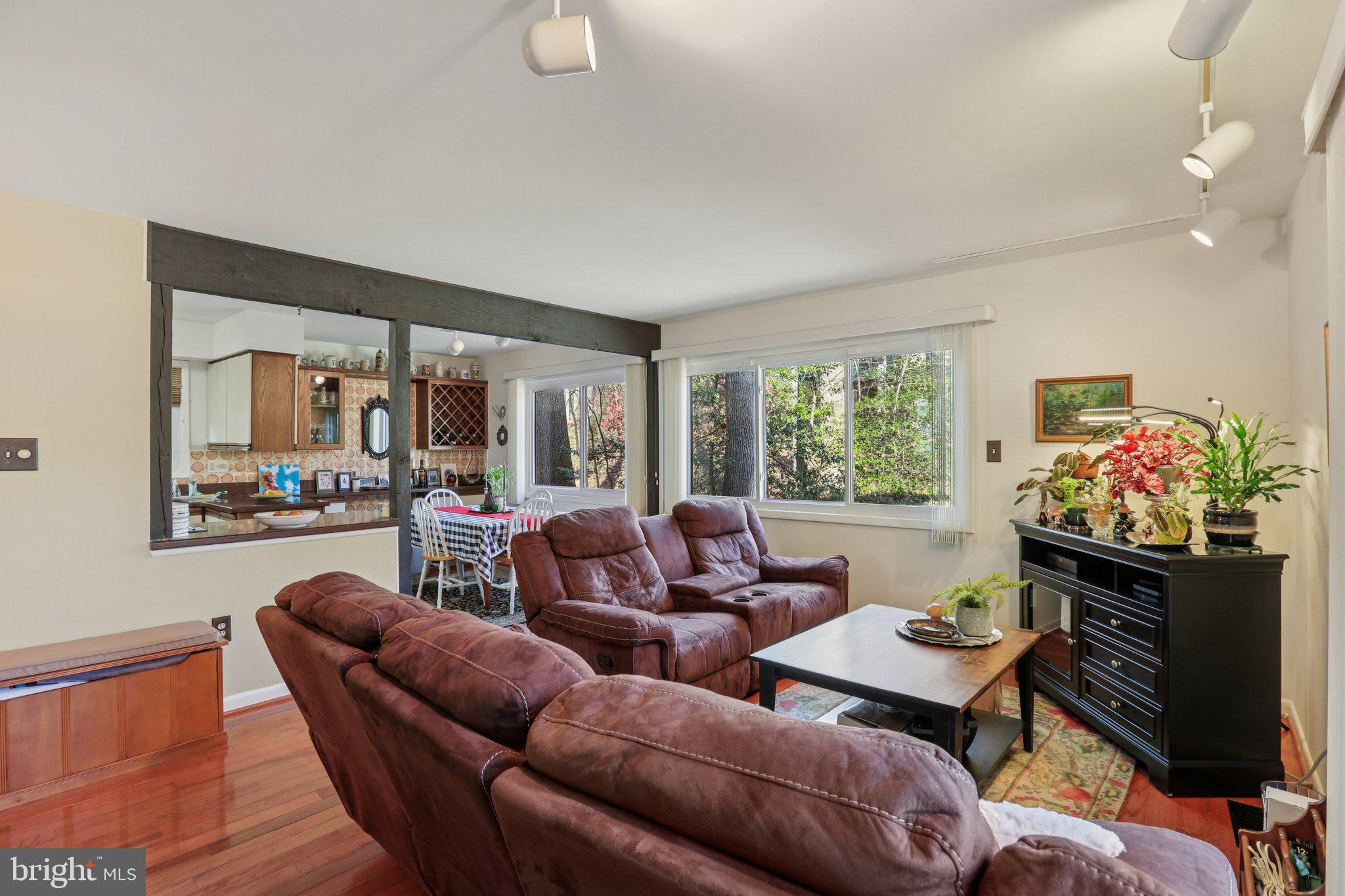 10968 Swansfield Road Columbia, MD 21044 - Photo 12 of 57 a living room with furniture and a large window